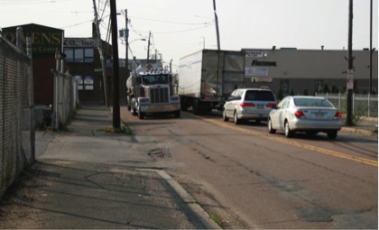 FIGURE 11. Second Street in Everett: Very Narrow and in Poor Condition
Figure 11 shows a gasoline tanker semi-trailer passing a refrigerated semi-trailer at a narrow point on Second Street.
