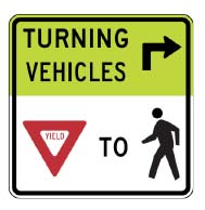 Figure 9, MUTCD Sign R10-15: Turning Vehicles Yield to Pedestrians
Figure 8 is a picture of a street sign that indicates, using words arrows, and icons, that turning vehicles need to yield to pedestrians. 
