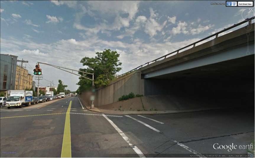 FIGURE 15. Embankment Approaching Interchange 28/Sullivan Square Exit, View Looking North from Mystic Avenue
Figure 15 contains a color photograph of the above-cited location.
