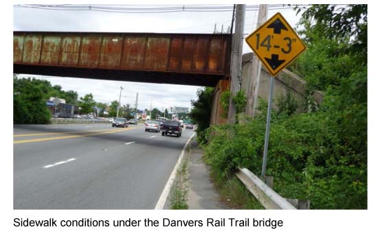 Image shows the sidewalk conditions under the Danvers Rail Trail bridge