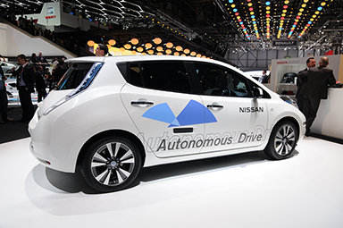 A white car with Autonomous Drive written on its side.
