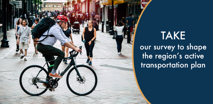 Image of a cyclist in front of pedestrians on a road. Text that says "Take our survey to shape the region's active transportation plan."